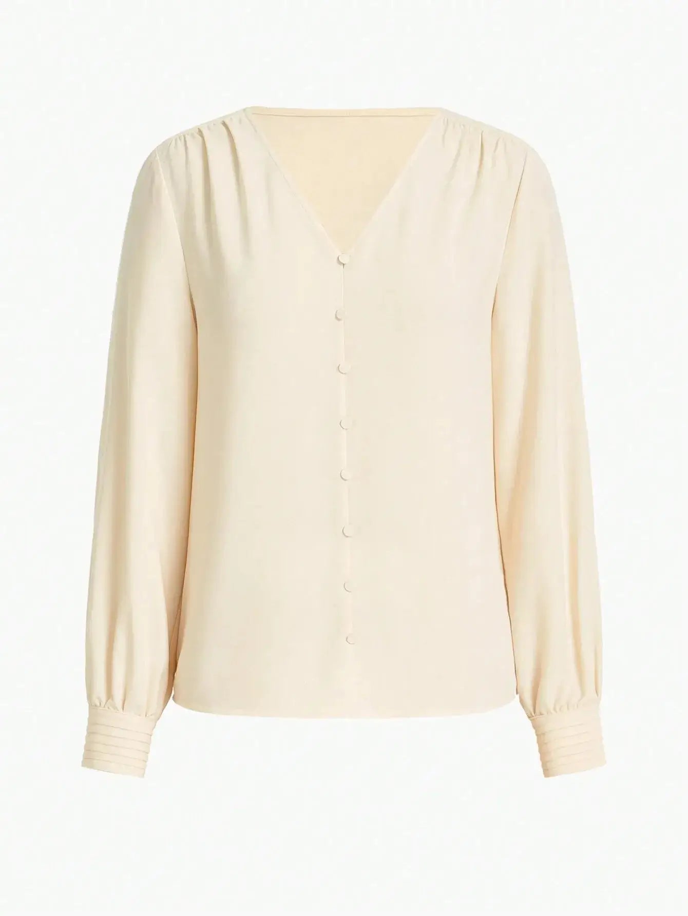 Blouse en polyester (95%) et élasthanne (5%), offrant une douceur supérieure. Conception fluide avec manches longues et col rond pour une élégance discrète. Teinte beige intemporelle. Finitions impeccables et coutures discrètes. Lavage à la main recommandé pour maintenir la qualité des fibres.